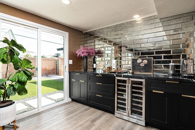 8341 E Hubbell St, Scottsdale, AZ 85257 - indoor wet bar with wine cooler, light wood-type flooring, and recessed lighting