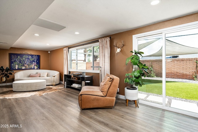 8341 E Hubbell St, Scottsdale, AZ 85257 - living area featuring wood finished floors, recessed lighting, and baseboards