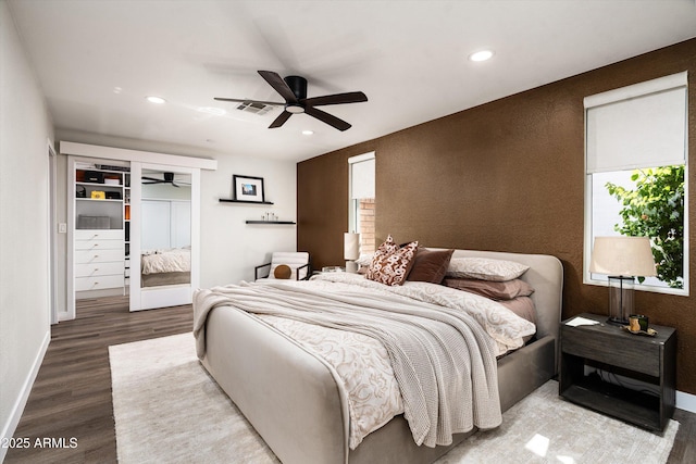 8341 E Hubbell St, Scottsdale, AZ 85257 - bedroom with recessed lighting, wood finished floors, multiple windows, and baseboards