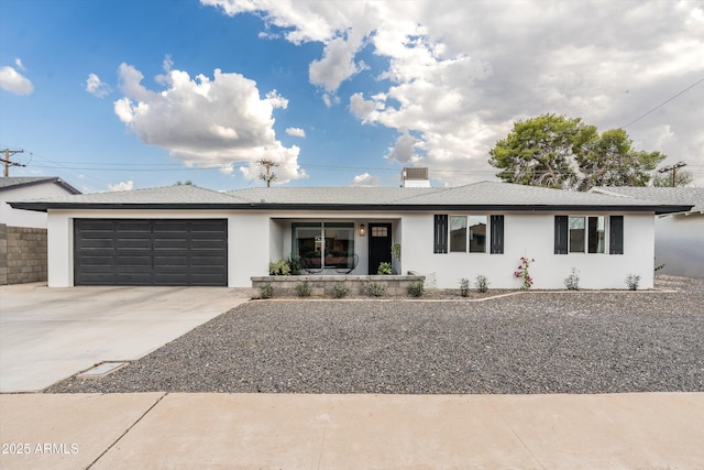 8341 E Hubbell St, Scottsdale, AZ 85257 - ranch-style house featuring an attached garage, concrete driveway, and stucco siding