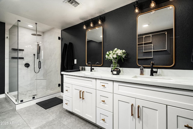 8341 E Hubbell St, Scottsdale, AZ 85257 - bathroom with double vanity, a shower stall, and tile patterned flooring