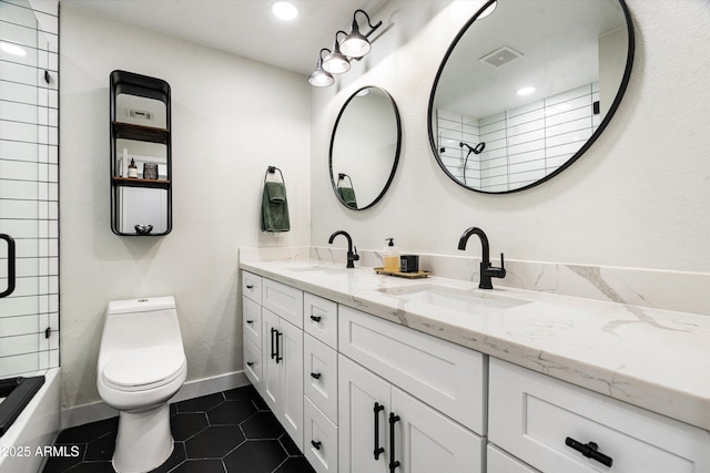 8341 E Hubbell St, Scottsdale, AZ 85257 - full bath with double vanity, toilet, tile patterned floors, baseboards, and shower / bath combination