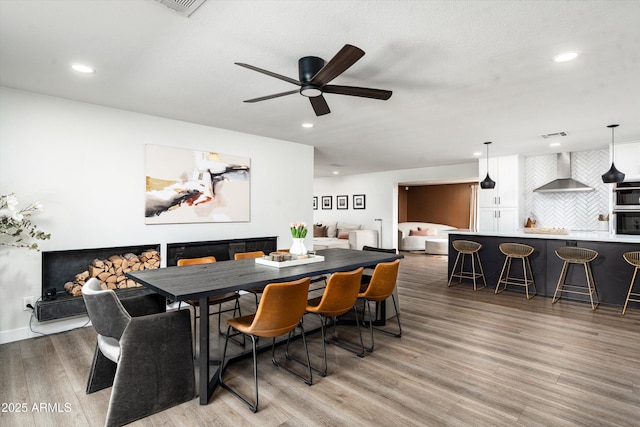 8341 E Hubbell St, Scottsdale, AZ 85257 - dining room with ceiling fan, light wood-style floors, recessed lighting, and baseboards