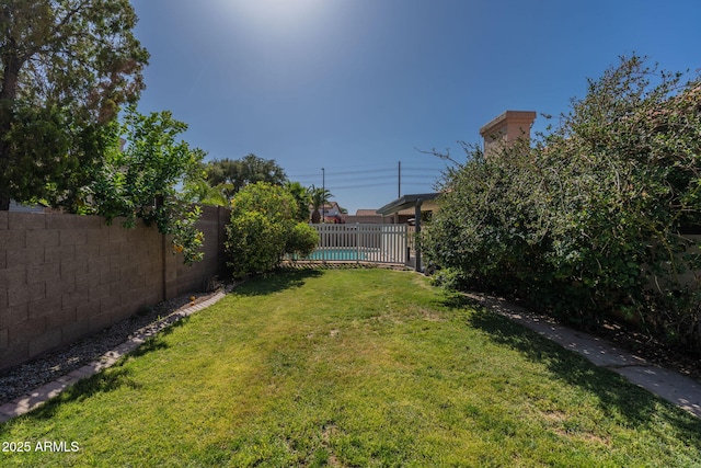 view of yard with a fenced backyard