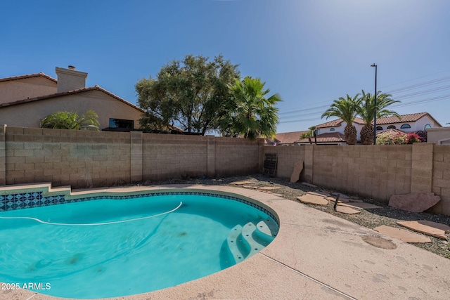 view of pool featuring a fenced in pool and a fenced backyard