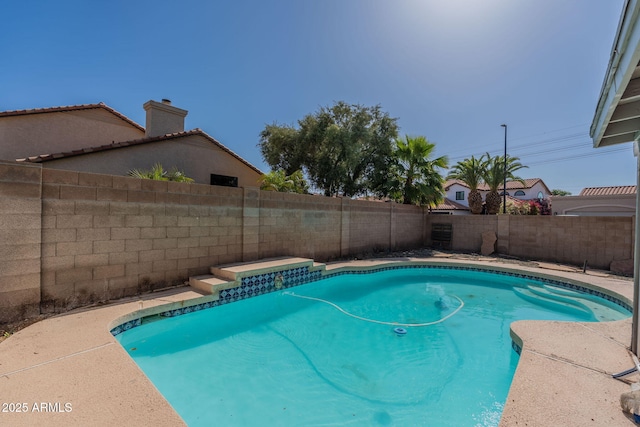 view of swimming pool with a fenced in pool and a fenced backyard