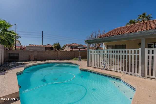 view of pool featuring a fenced in pool and a fenced backyard
