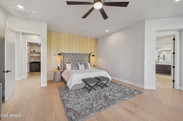 bedroom with light wood-type flooring and ceiling fan