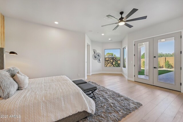 bedroom with french doors, ceiling fan, access to outside, and light hardwood / wood-style flooring