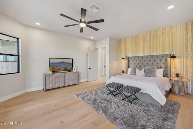 bedroom featuring ceiling fan and light hardwood / wood-style flooring