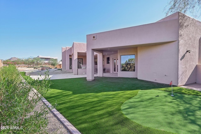 back of house featuring a patio