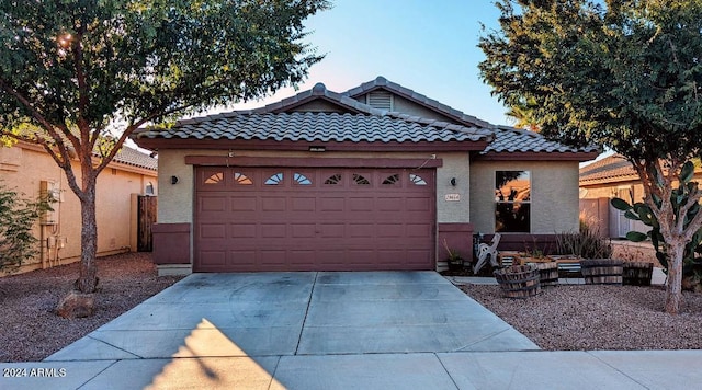 view of front of property with a garage