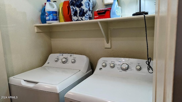 laundry area featuring washing machine and clothes dryer