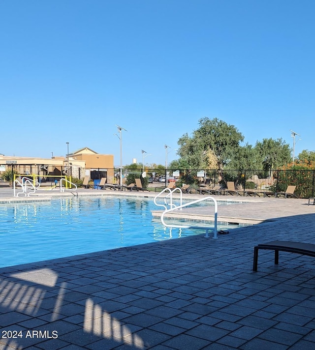 view of pool featuring a patio