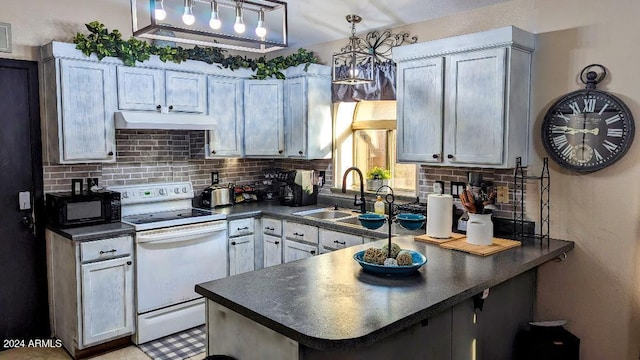 kitchen with decorative light fixtures, tasteful backsplash, kitchen peninsula, sink, and white electric range oven