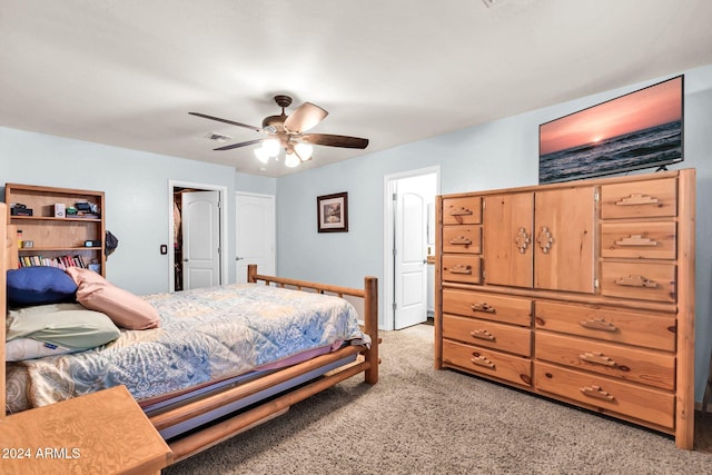 bedroom featuring ceiling fan and light carpet