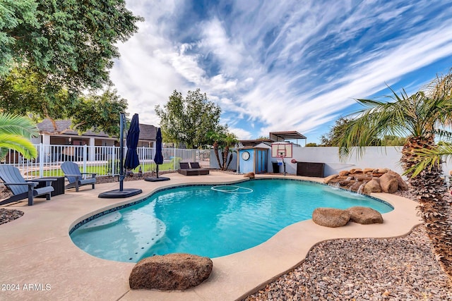 view of swimming pool with a patio area and pool water feature