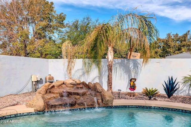 view of pool with pool water feature