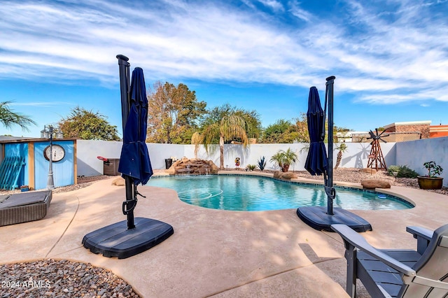 view of swimming pool featuring a patio and pool water feature