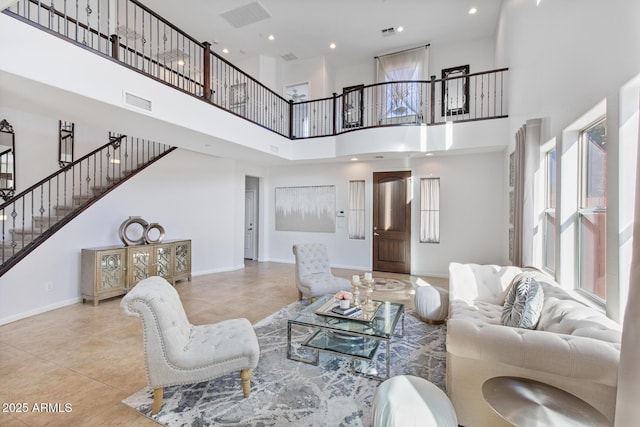 tiled living room with a towering ceiling