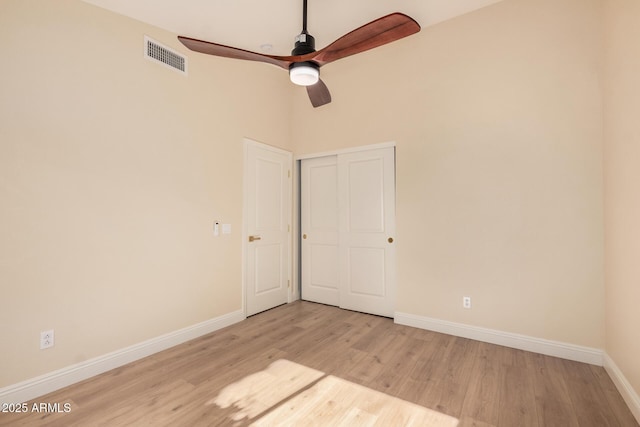 spare room featuring light hardwood / wood-style floors and ceiling fan