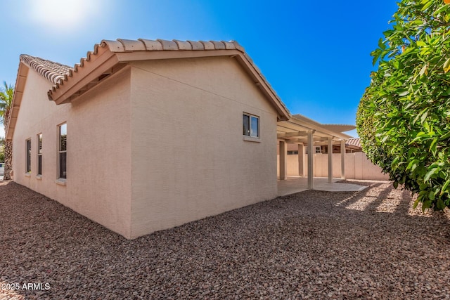 view of home's exterior with a patio