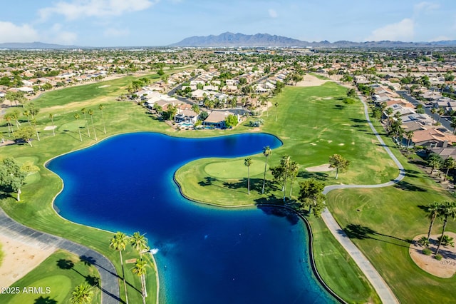 aerial view featuring a water and mountain view