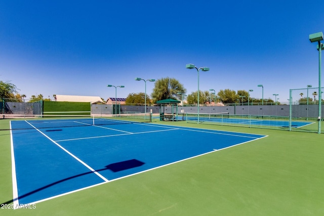 view of sport court with basketball hoop