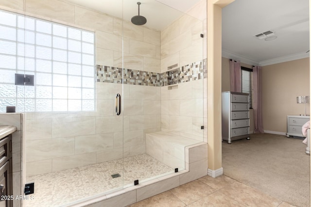 18171 W Marshall Ln, Surprise, AZ 85388 - bathroom with crown molding, baseboards, a shower stall, and visible vents