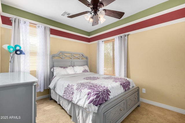 18171 W Marshall Ln, Surprise, AZ 85388 - bedroom featuring visible vents, baseboards, ceiling fan, and light carpet
