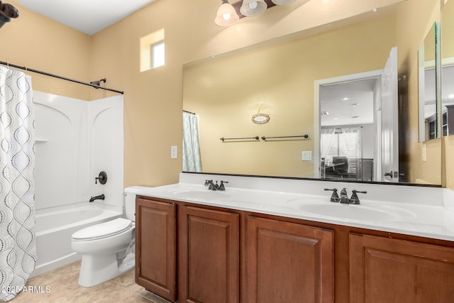 18171 W Marshall Ln, Surprise, AZ 85388 - full bathroom with a sink, shower / bath combo with shower curtain, toilet, and double vanity