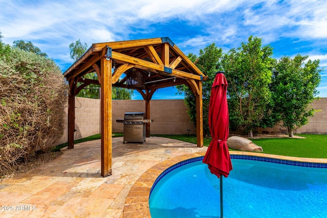 18171 W Marshall Ln, Surprise, AZ 85388 - view of pool with a gazebo, area for grilling, a fenced in pool, a fenced backyard, and a patio area