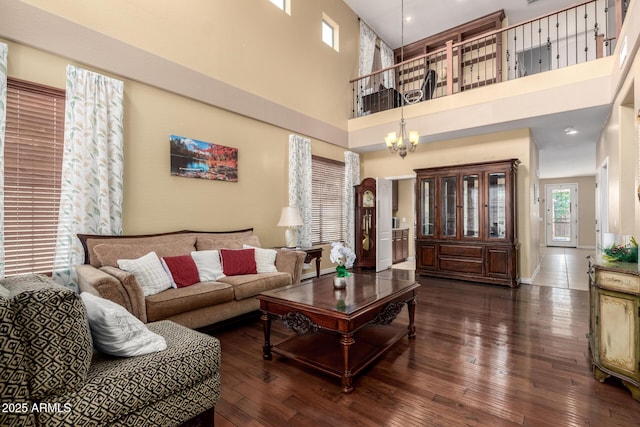 18171 W Marshall Ln, Surprise, AZ 85388 - living area featuring a towering ceiling, baseboards, hardwood / wood-style floors, and a chandelier