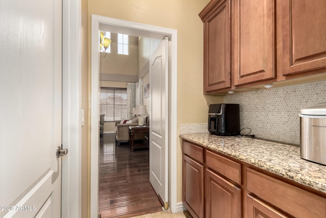 18171 W Marshall Ln, Surprise, AZ 85388 - interior space featuring light wood-type flooring and tasteful backsplash