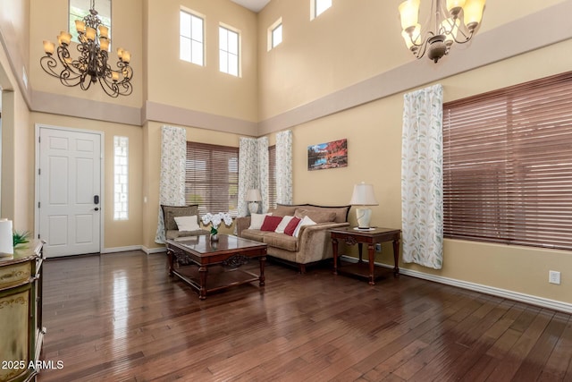 18171 W Marshall Ln, Surprise, AZ 85388 - living room featuring baseboards, an inviting chandelier, a wealth of natural light, and hardwood / wood-style floors