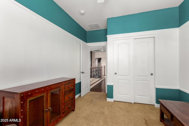 18171 W Marshall Ln, Surprise, AZ 85388 - unfurnished bedroom with a closet, baseboards, visible vents, and light carpet