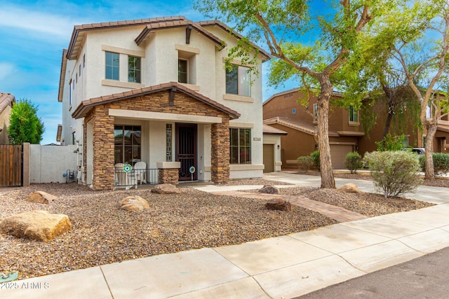 18171 W Marshall Ln, Surprise, AZ 85388 - view of front of house with covered porch, stucco siding, and stone siding
