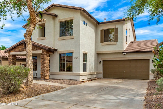 18171 W Marshall Ln, Surprise, AZ 85388 - mediterranean / spanish-style house with an attached garage, stucco siding, a tiled roof, and driveway