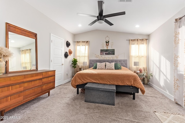 carpeted bedroom with lofted ceiling, baseboards, multiple windows, and visible vents