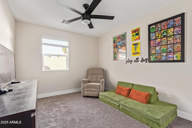 interior space featuring a ceiling fan, carpet flooring, and baseboards