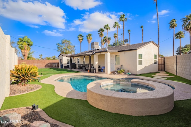 view of pool featuring a patio area, a fenced backyard, a pool with connected hot tub, and central AC unit