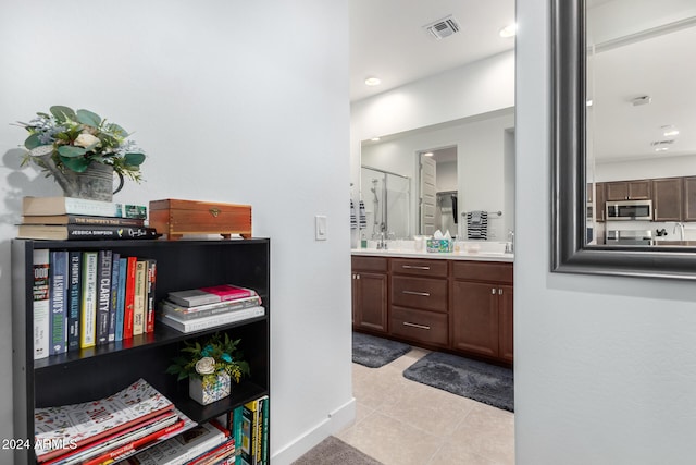 bathroom with vanity and tile patterned flooring