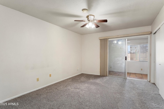 unfurnished bedroom featuring baseboards, ceiling fan, and carpet floors