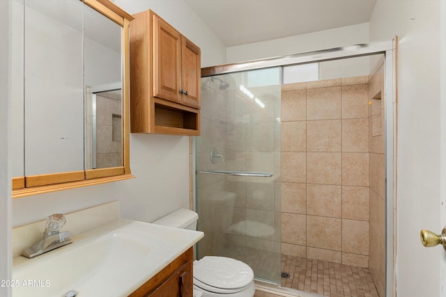 full bath featuring a stall shower, toilet, and vanity