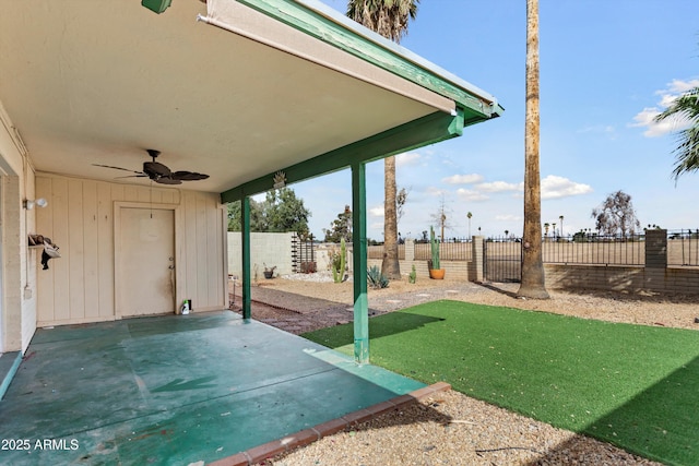 view of patio with ceiling fan and a fenced backyard