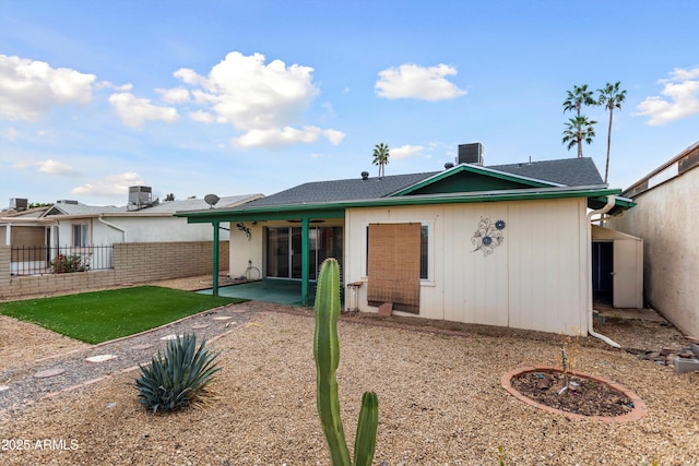 back of property featuring a patio area, central AC unit, and fence