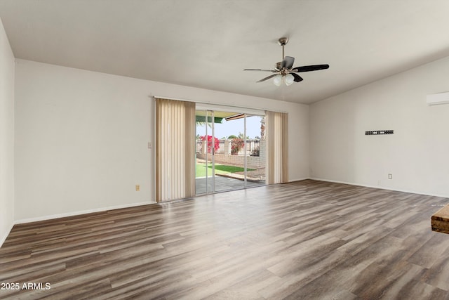 spare room with vaulted ceiling, baseboards, a ceiling fan, and wood finished floors