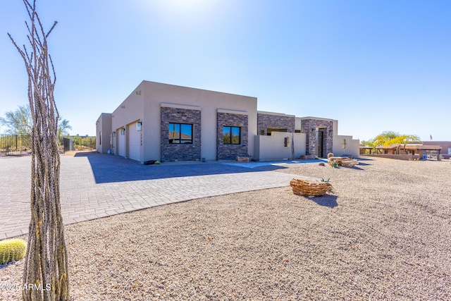 pueblo-style house featuring a patio area