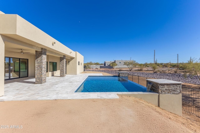 view of pool featuring a patio and ceiling fan