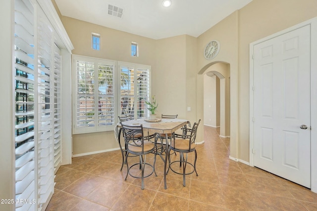 tiled dining area with a wealth of natural light